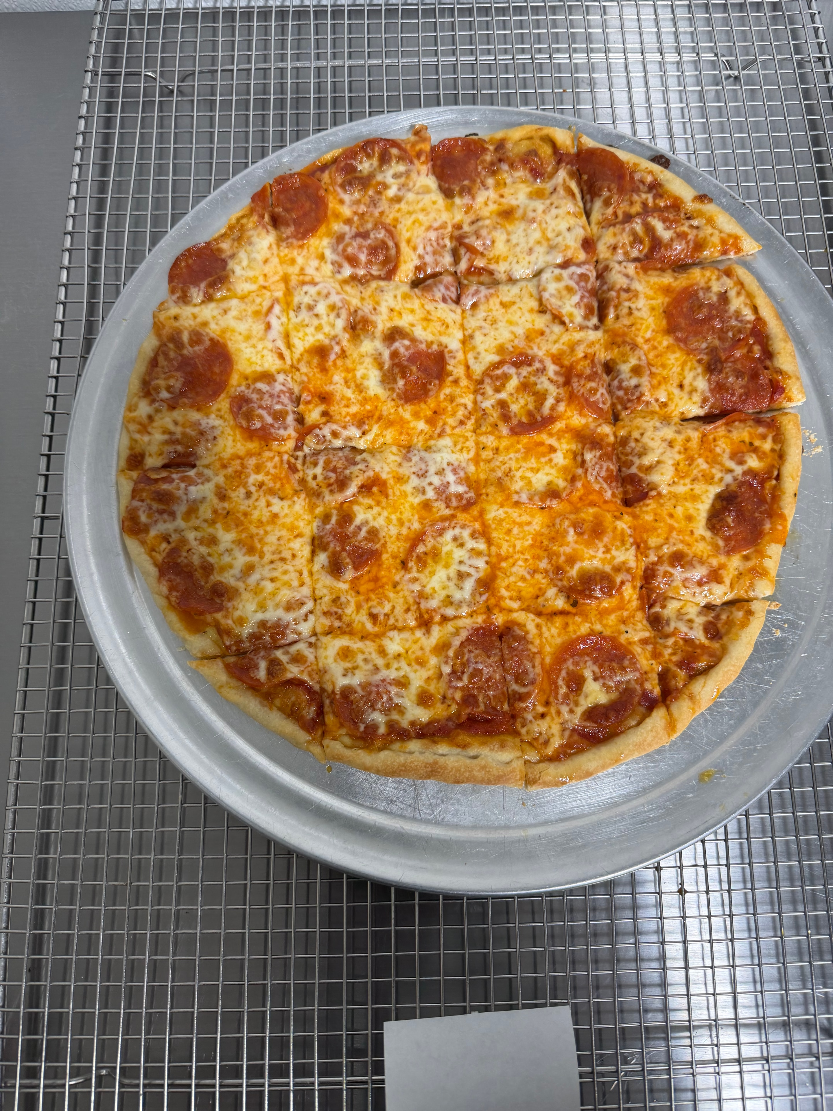 Pepperoni pizza sliced on plate